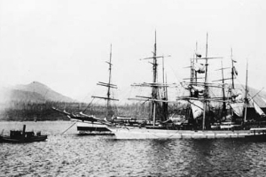 historical black and white photo - tugboat towing sail boat