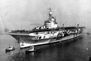 historical photo, black and white photo tugboats towing aircraft carrier