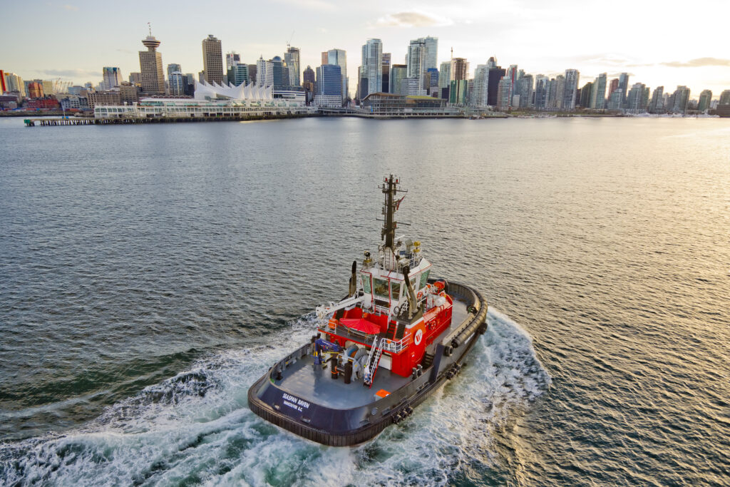seaspan raven sailing south in port of vancouver