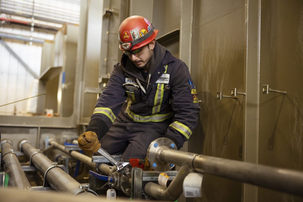 person connecting pipes