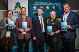 group of people with green marine award
