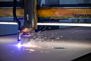 sparks flying on automated steel cutting machine