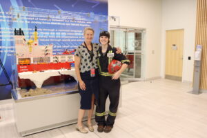 Seaspan employees in front of Polar Icebreaker Lego model