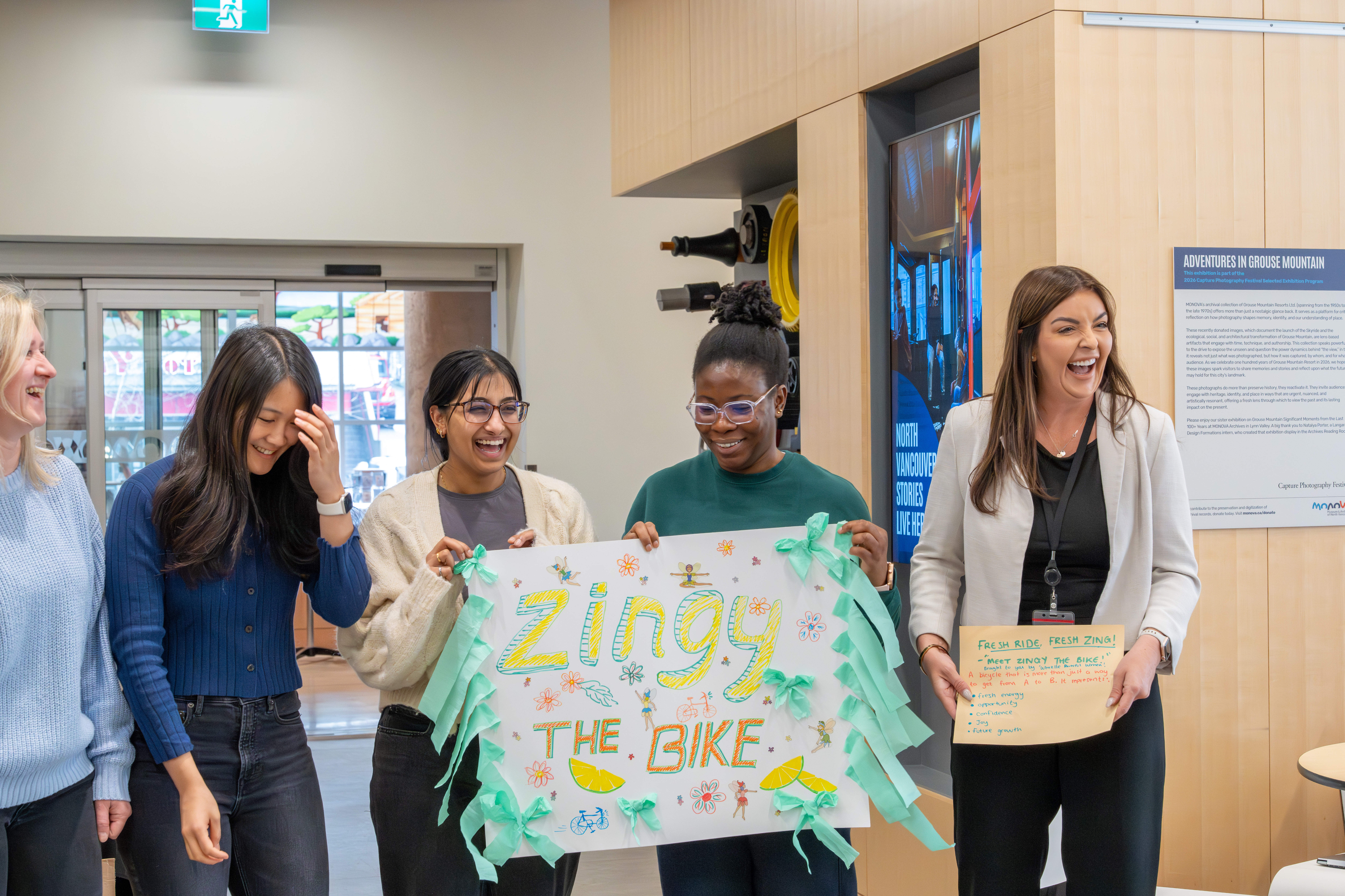 The "Zingy" team poses with their team poster