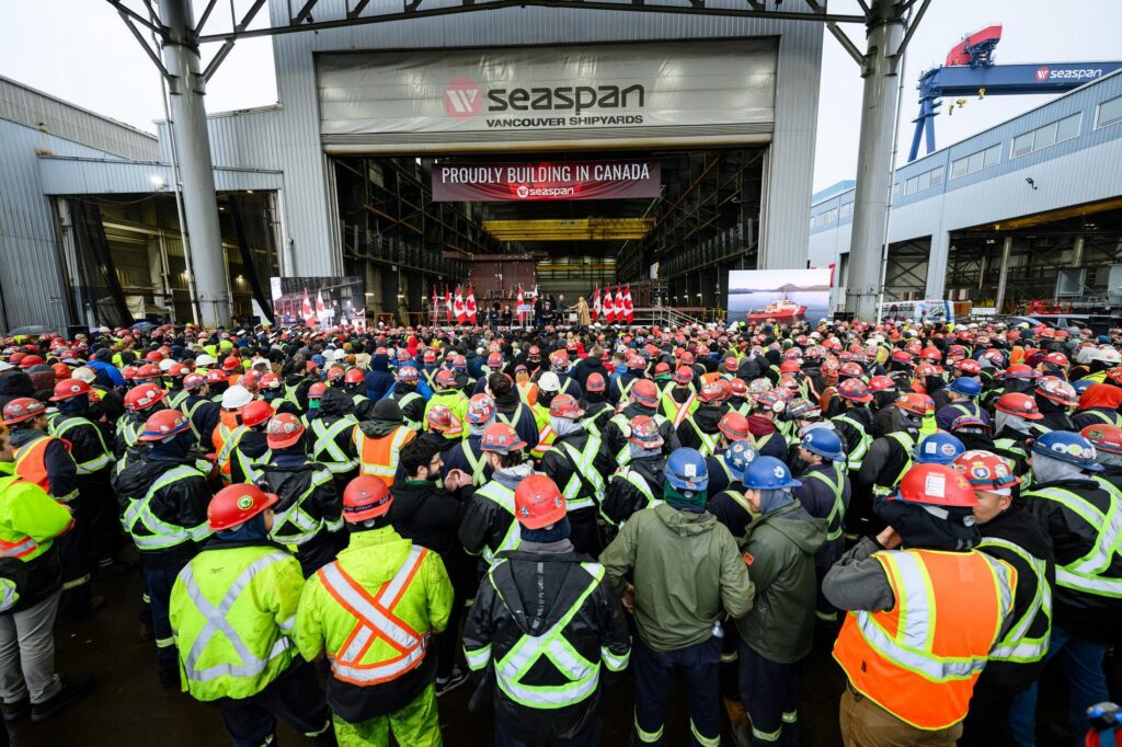 crowd at Vancouver Shipyards looks ahead at block assembly shop