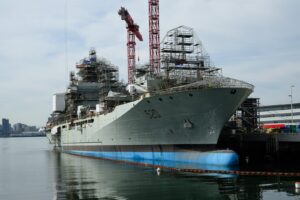 blue and grey large joint support ship in ocean
