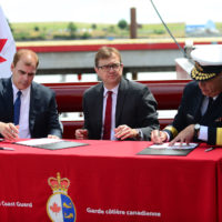 The Honourable Jonathan Wilkinson and Coast Guard Deputy Commissioner Andy Smith officially accept the CCGS Sir John Franklin from Seaspan.